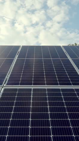vertical video with close-up view of solar panels arranged in a grid pattern