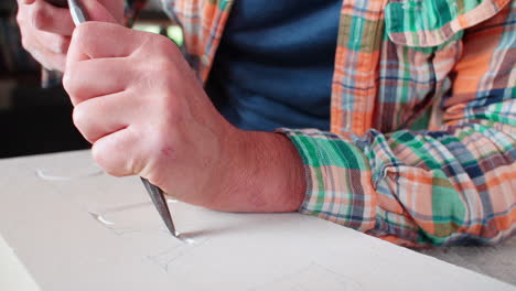 Slow-Motion-Shot-Of-Stone-Mason-At-Work-On-Carving-In-Studio