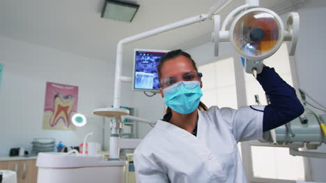 patient pov in dental chair making periodic teeth check
