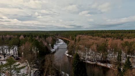 view of anyksciai laju takas, treetop walking path complex with a walkway, an information center and observation tower, located in anyksciai, lithuania near sventoji river