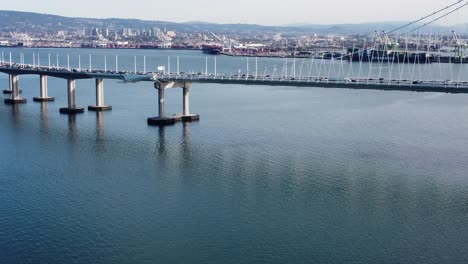 slow ascending drone shot of the san francisco bay bridge