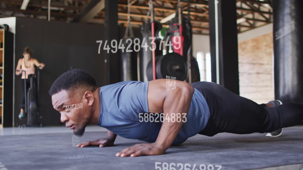 Man starting plank lowering torso and doing push-ups for fitness while numeric overlay obscuring