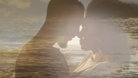 animation of romantic african american couple at beach touching heads, over sea