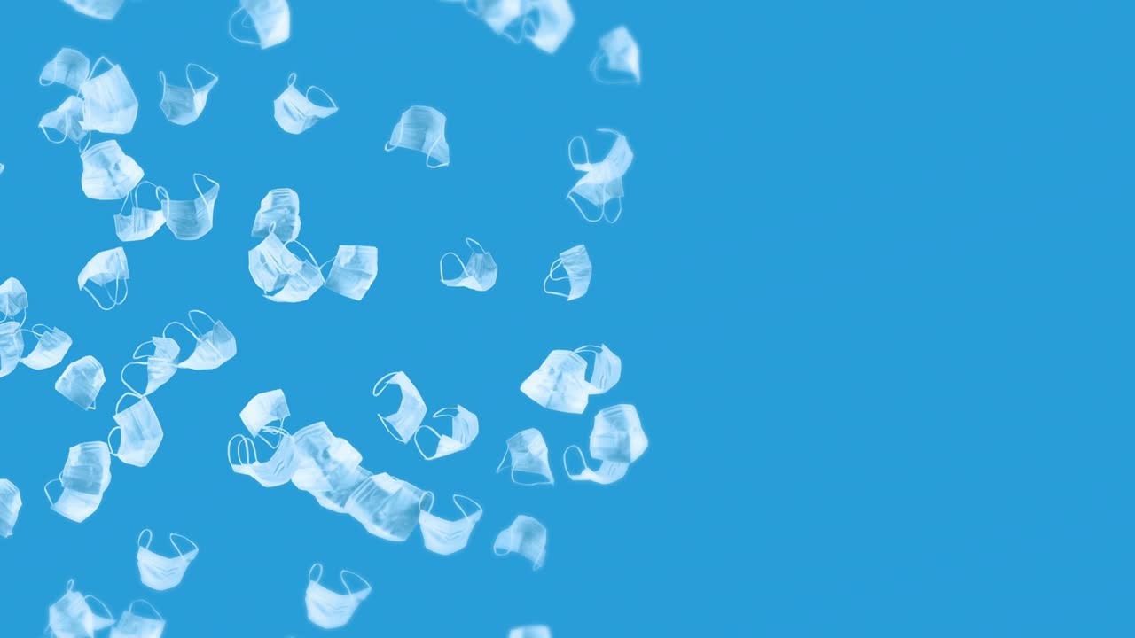 파란색 바탕에 많은 색 마스크를 날리는 의료 개념, 수술 보호 마스크, 마스크 회전의 3d 애니메이션, 루프 애니메이션.