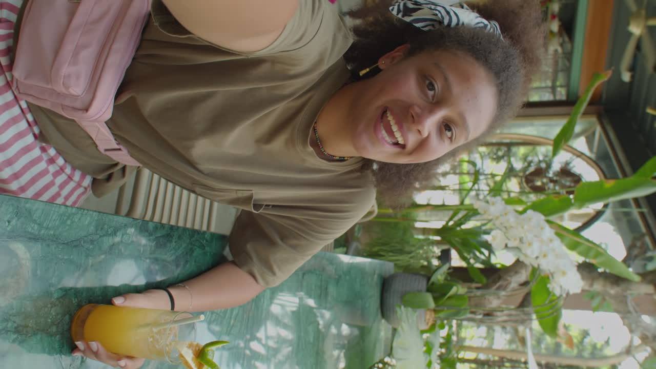 Girl Making Vlog or Video Calling in Outdoor Cafe