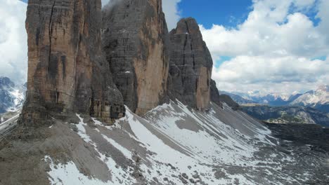 three peaks of lavaredo with snow at the base in dolomiti, italy