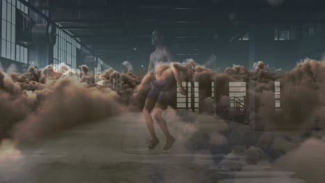 animación de nubes sobre un deportista afroamericano haciendo ejercicio