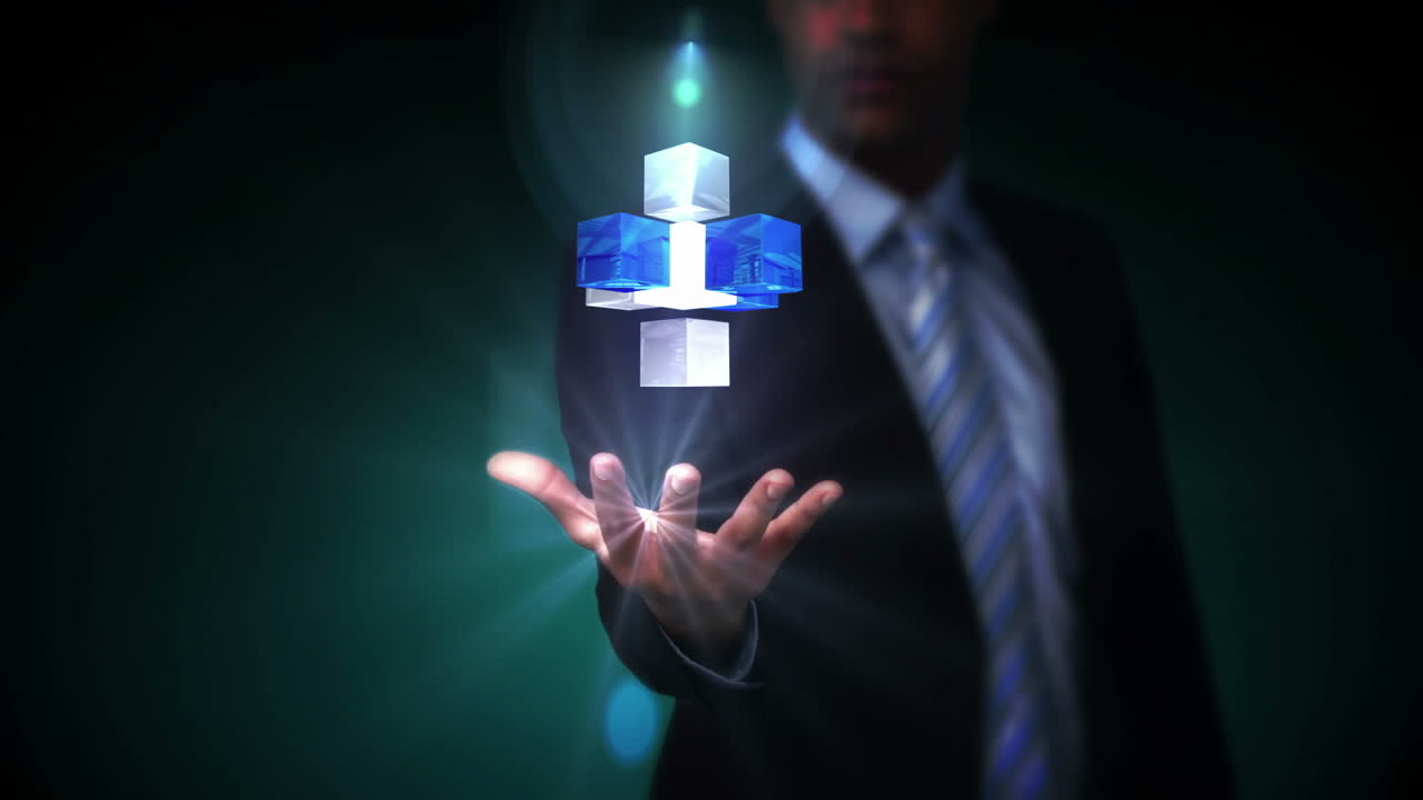Businessman presenting holographic cubes
