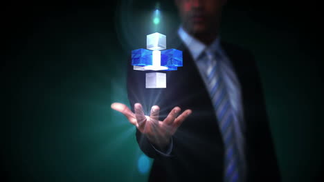 hombre de negocios presentando cubos holográficos