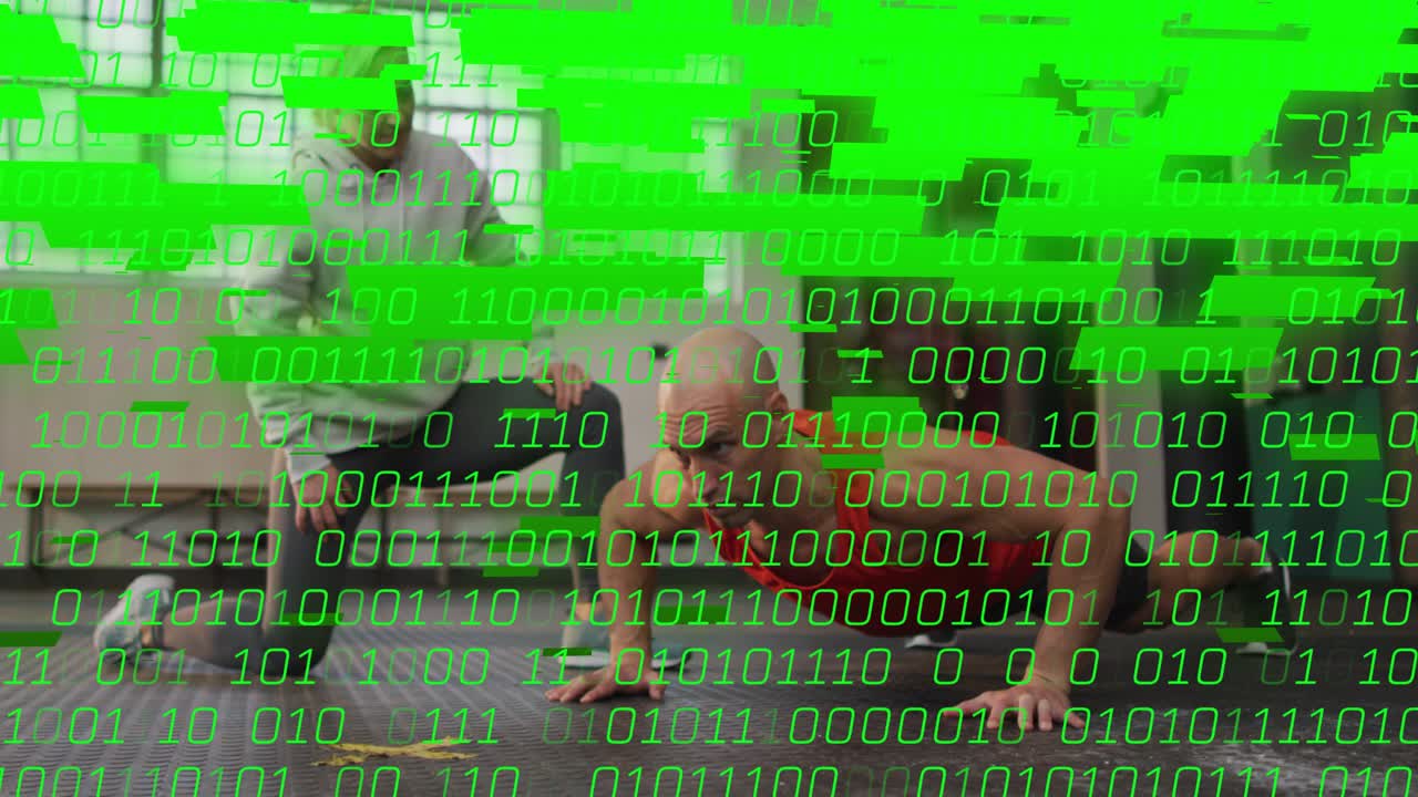 Coach cueing trainee doing pushups for form in gym, green binary overlay growing, obscuring view