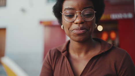 woman wearing glasses with happy expression