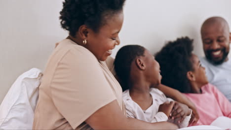 Happy,-tickling-and-black-family-having-fun-in-bed