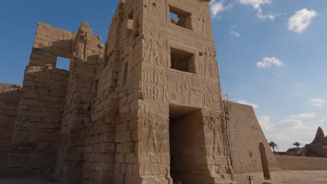 View-against-blue-sky-of-entrance-to-Medinet-Habu-temple-in-Luxor,-Egypt