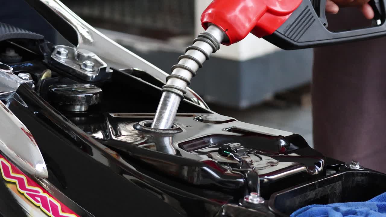 Sequential fueling process of a motorcycle tank | Premium Stock Video ...