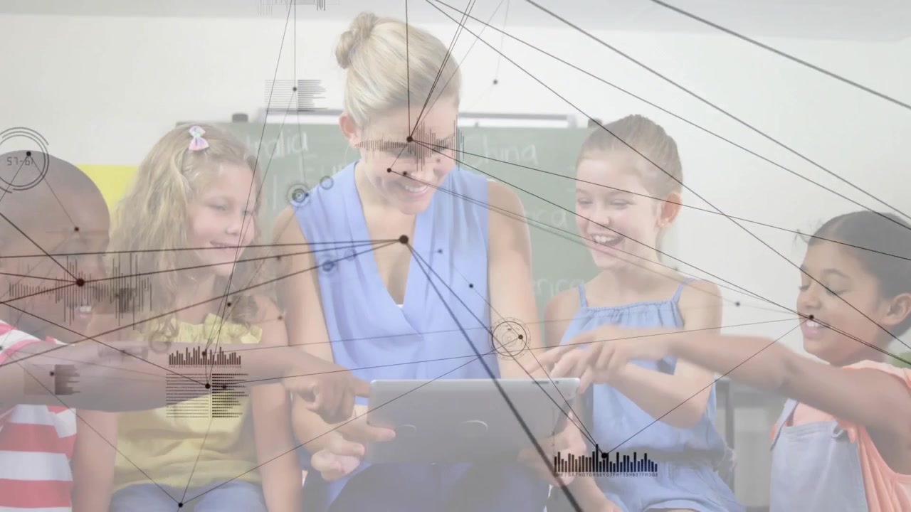 Female teacher tapping tablet while guiding children exploring interactive classroom map
