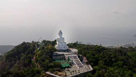 aerial view of big buddha statue on hill in phuket, wide circling