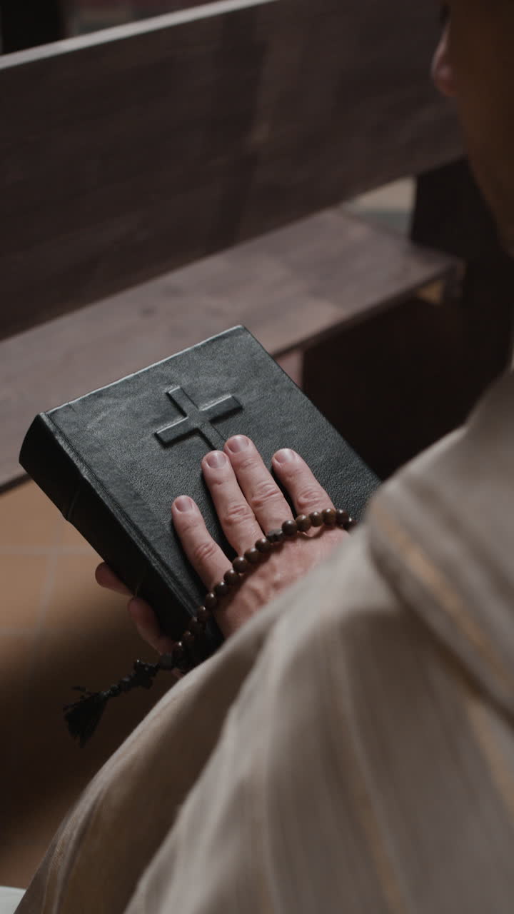 Religious scene with a Bible, rosary, and person