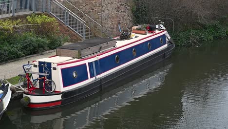 anal boat that holds screen on the canal in regents canal, london, united kingdom