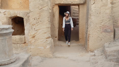 woman exploring ancient tombs