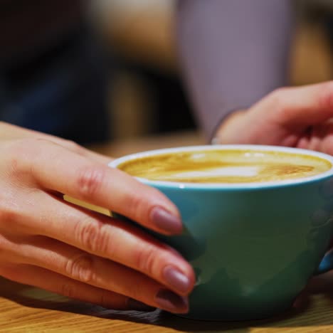 cup of coffee on wooden table