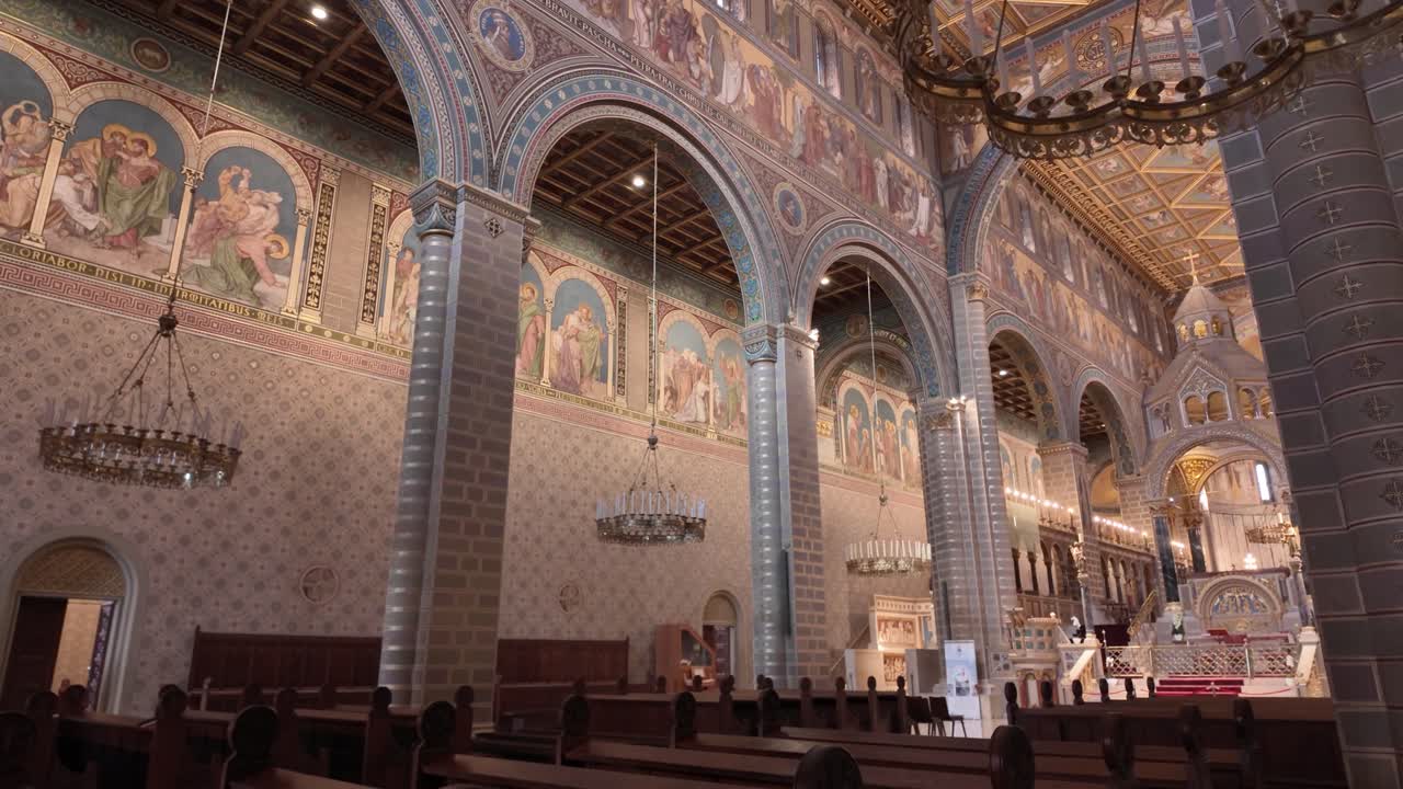 Elegant view of Pécs Cathedral inside, emphasizing baroque details, elegant arches, and magnificent decorative elements