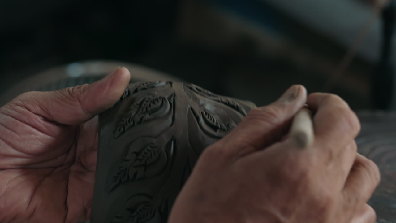 Artisan crafting a clay bowl