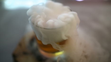 dry ice in glass while bartender preparing drink 7