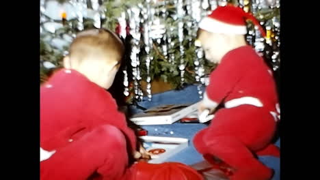 Kids Sitting on Top of Table, 1970s USA. CIRCA USA - 1970s: A candid shot of two children sitting on top of a table in a 1970s setting in the USA.