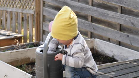 future gardener baby working in the garden
