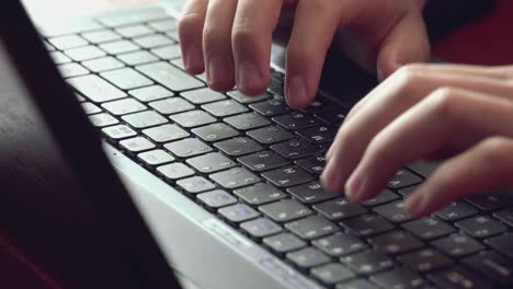 close-up of hands of unrecognizable business man typing on laptop keyboard 02