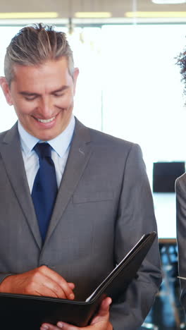 business team standing together discussing work