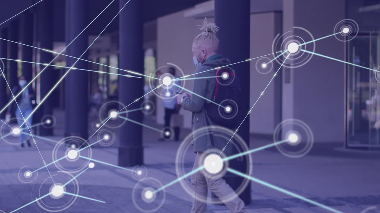 Animation of network of connections over albino african american man in face mask with smartphone