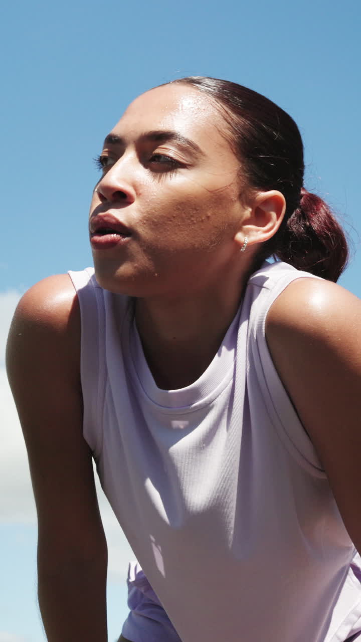 Tired Young Woman Wiping Sweat After Outdoor Workout