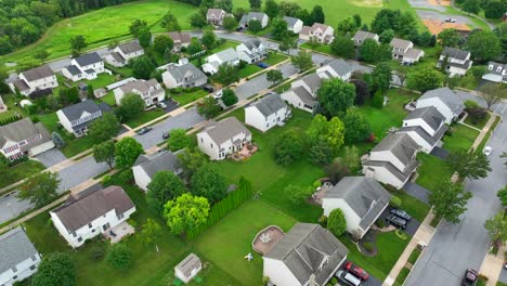 suburban neighborhood with rows of houses and green lawns