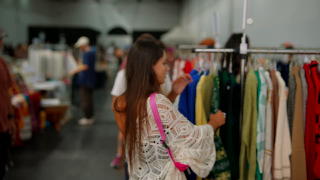 Women shopping for clothes at a market