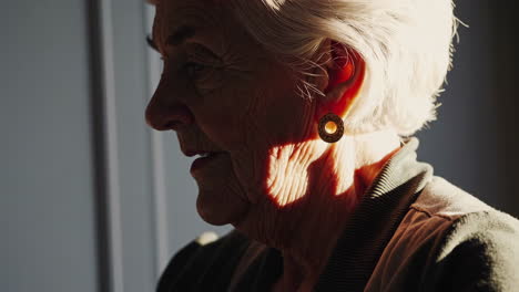 sunlight through curtains and a senior woman's profile