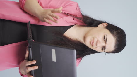 Vertical-video-of-Unsuccessful-business-woman.-She-looks-at-the-camera-negatively.