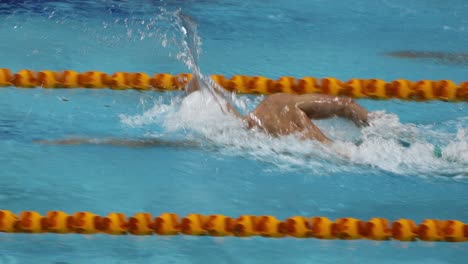 athlete swimming laps in a competitive race