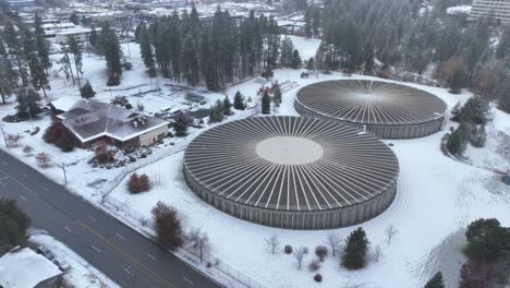 establishing aerial view of two massive water reservoir structures in spokane, washington