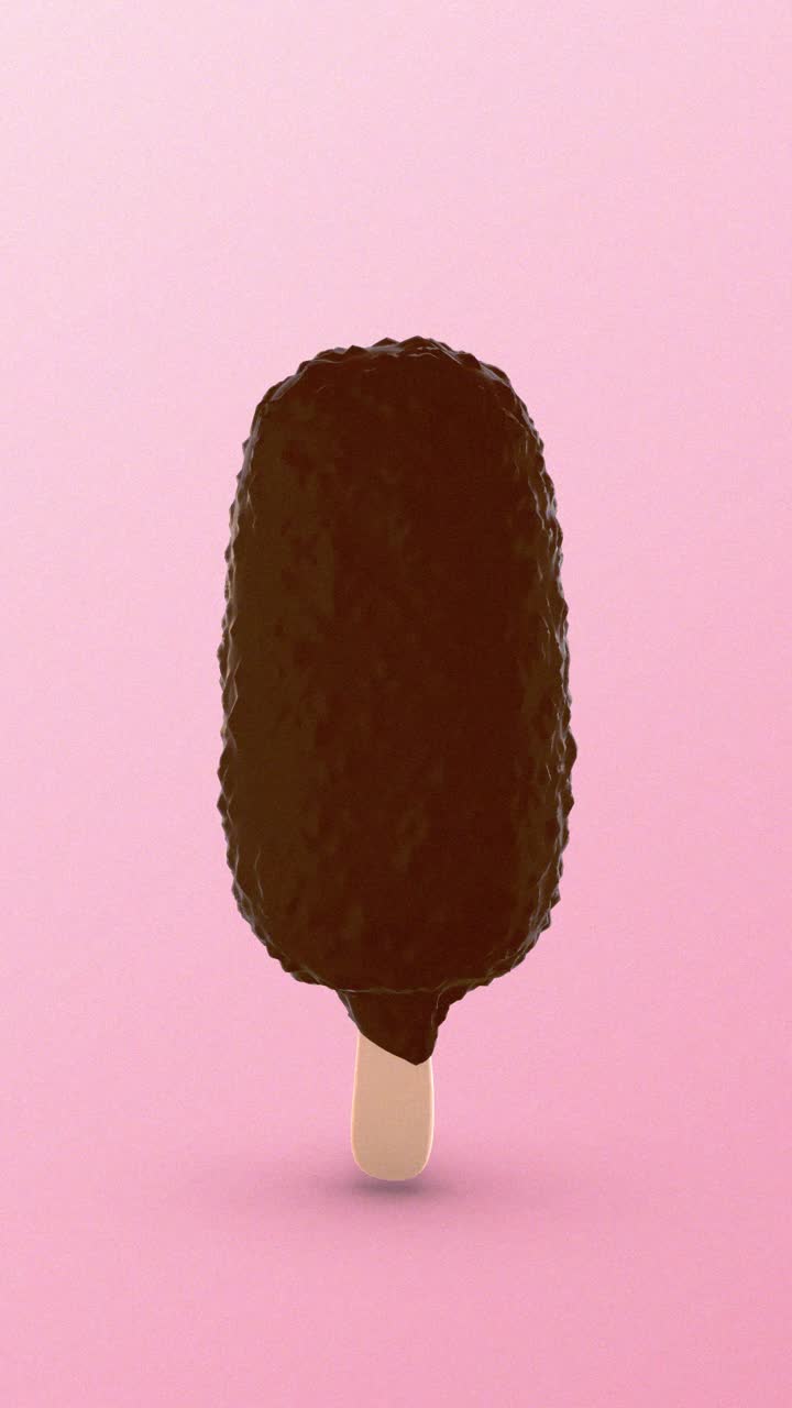 Barretta di gelato ricoperta di cioccolato che ruota su sfondo rosa