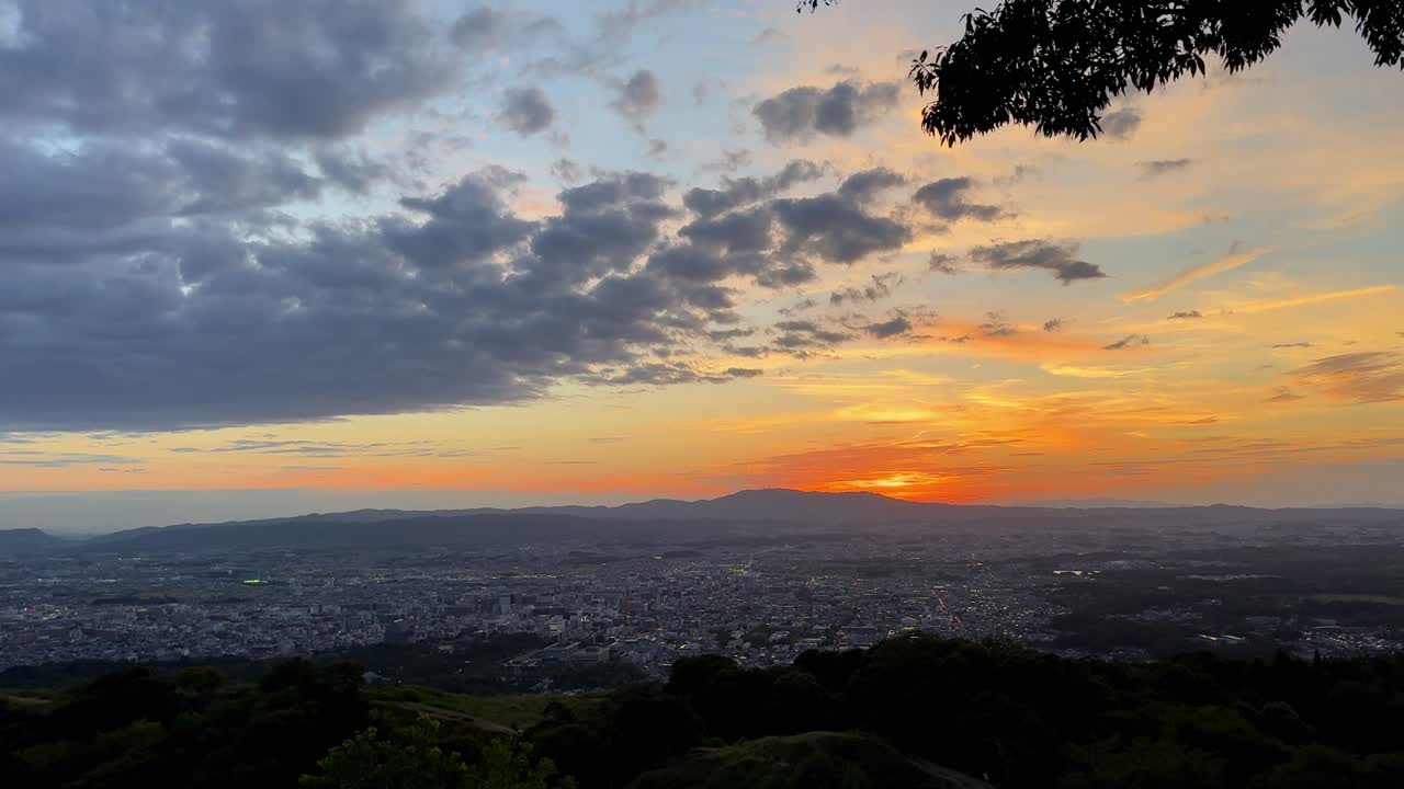 Sunset view over Nara from Mount Wakakusa, vibrant skies and cityscape