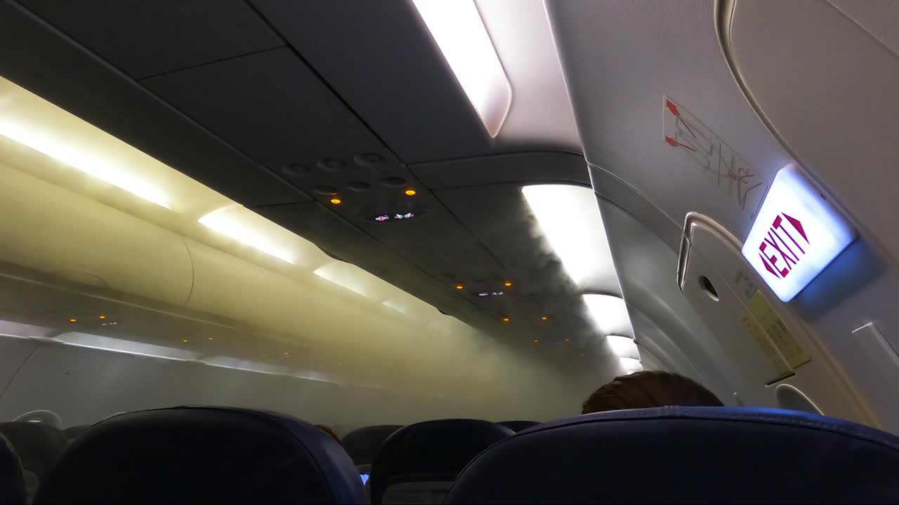 Fog Filling Airplane Cabin, Coming Out From Airconditioning Vents Due To Hot And Humid Outside Air Condensing. - POV
