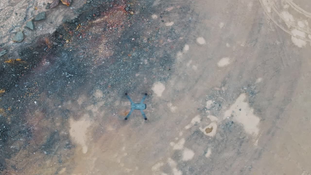 Aerial top down view of drone aircraft fly above rocky terrain, Czechia
