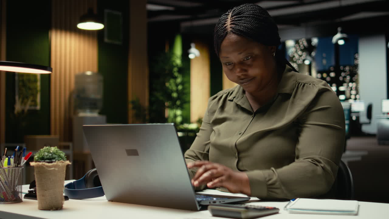 Female worker correcting pose and stretching her neck muscles