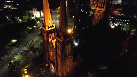 Aerial-circling-gothic-Church-St-Patricks-Melbourne-at-night