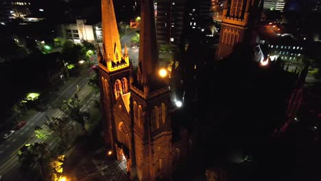 aerial circling gothic church st patricks melbourne at night