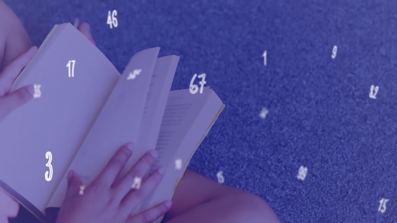 한 여학생이 도서관에서 바닥에 앉아서 책을 읽고 있다.