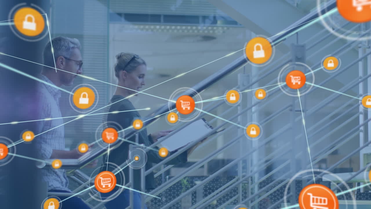 animación de una red de iconos digitales contra un hombre y una mujer caucásicos discutiendo en las escaleras de la oficina.
