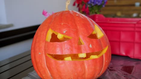 Huge-spooky-orange-pumpking-for-Halloween-holiday-party-decoration,-Jack-o-lantern-knife-carving