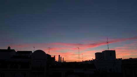 beautiful soft color palette summer sunset and sky seen in downtown madrid, spain